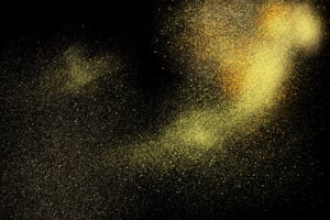 Freeze motion of yellow powder exploding, isolated on black, dark background. Abstract design of yellow dust cloud. Particles explosion screen saver, wallpaper.-1